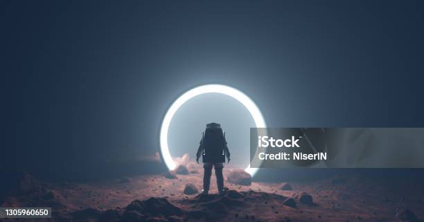 Astronaut On Foreign Planet In Front Of Spacetime Portal Light Stock Photo - Download Image Now