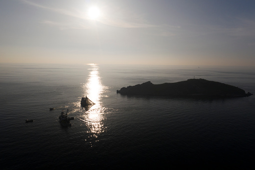 at sunset the fishermen have thrown their nets