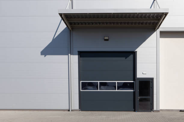 istock Gray iron shutter of an industrial building -warehouse gate. 1305960952