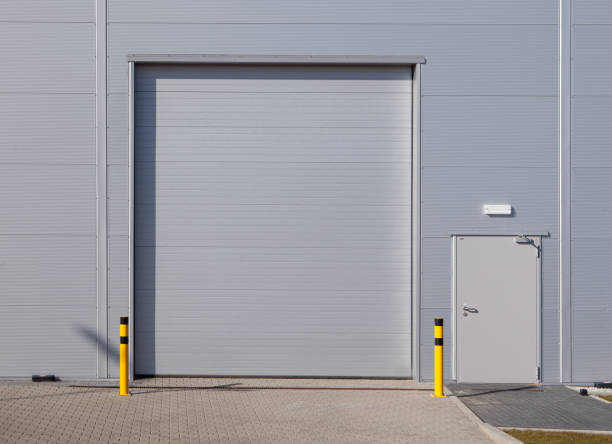 istock Gray roller shutter door - automatic metal roller door used in factory, storage, garage. 1305960976