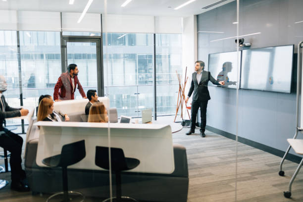 istock Businessman presenting to the team 1305961020