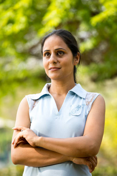 istock Thoughtful woman at park 1305963707