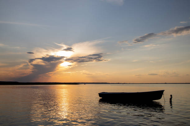 istock Fishing Boat at The Lake on Sunset 1305964904