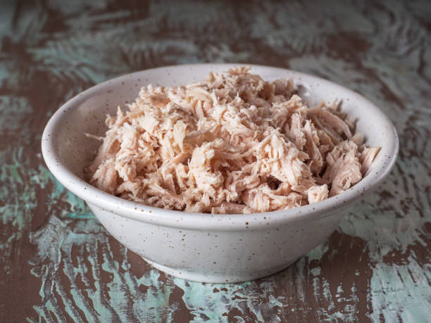 istock Finely chopped chicken fillet in a deep ceramic plate close-up 1305966939