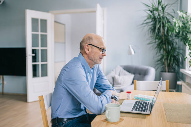istock Senior man having a video call with doctor 1305968335