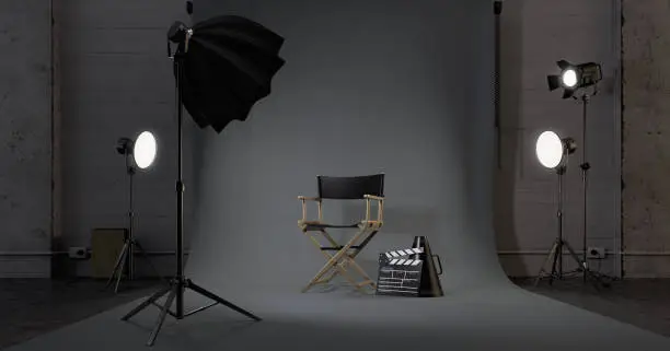 Photo of Director chair,Movie clapper in studio.Concept for film industry.3d rendering