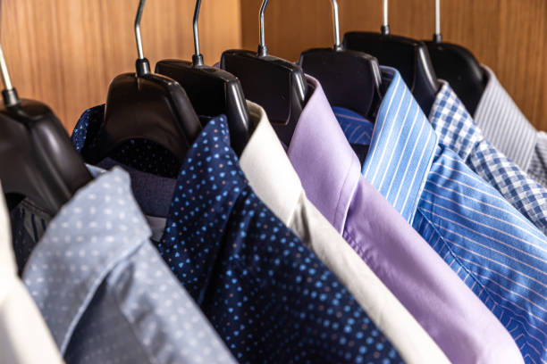 Shirts hanging in a closet. stock photo