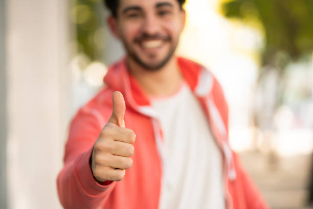istock Young man celebrating victory outdoors. 1305969562