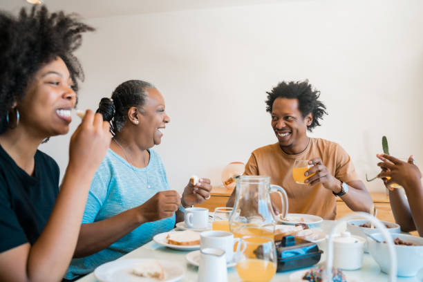 istock Family having breakfast together at home. 1305971330