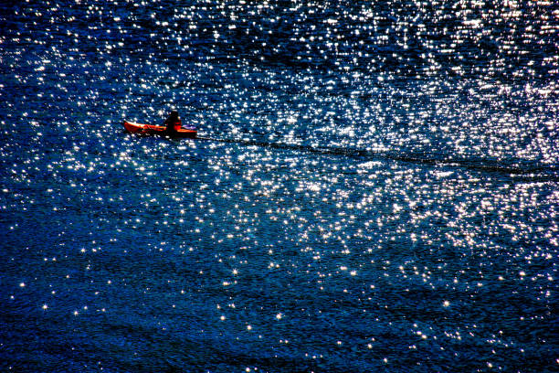 Kayaker in a galaxy of diamonds