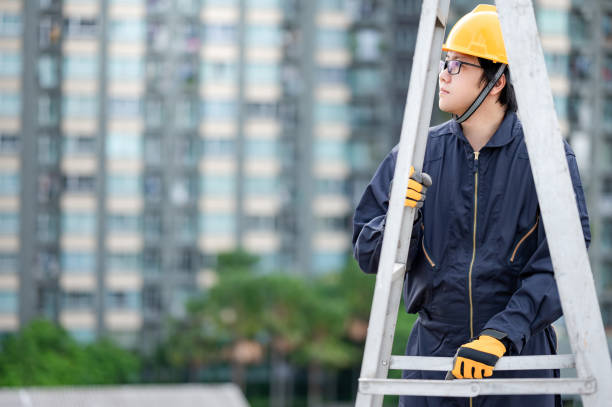 istock Male worker adjusting ladder at construction site 1305971749