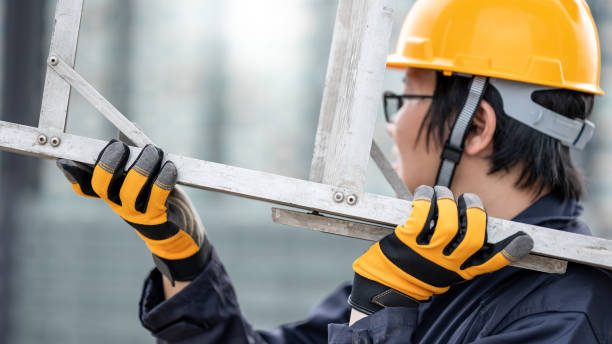 istock Maintenance worker man carrying aluminium ladder 1305971759