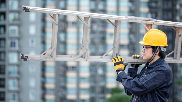 istock Maintenance worker man carrying aluminium ladder 1305971763