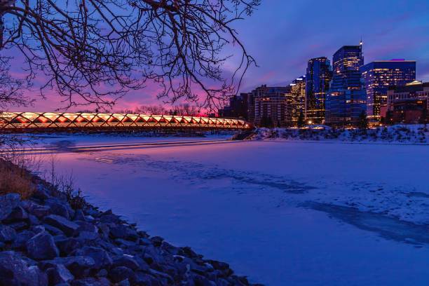 istock Colourful Sunrise Sky Over A Wintry Peace Bridge 1305974022