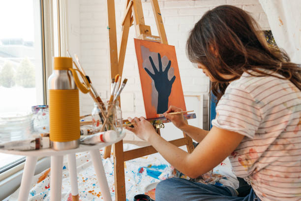 istock Artist working on her new drawing in home studio 1305974077