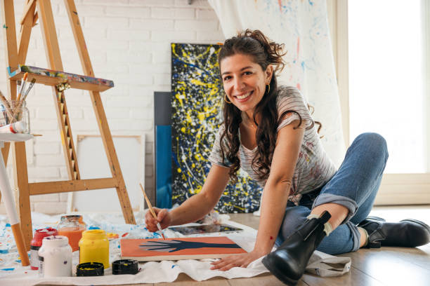 istock Artist portrait in her studio 1305974497