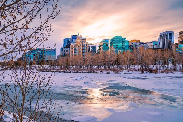 istock Sunrise Clouds Over A Frozen Calgary River 1305974524