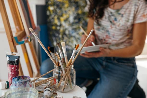 istock Artist working on her new drawing in home studio 1305974709