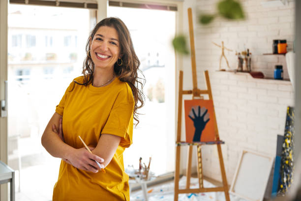 istock Artist portrait in her studio 1305974784