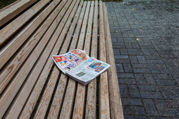 Chelyabinsk Russia August 8 2020 an abandoned magazine lies on a Park bench in the beginning rain