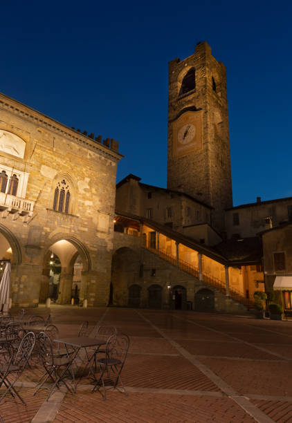 istock Bergamo - Torre del Comune at night on the Piazza Vecchia square 1305976184