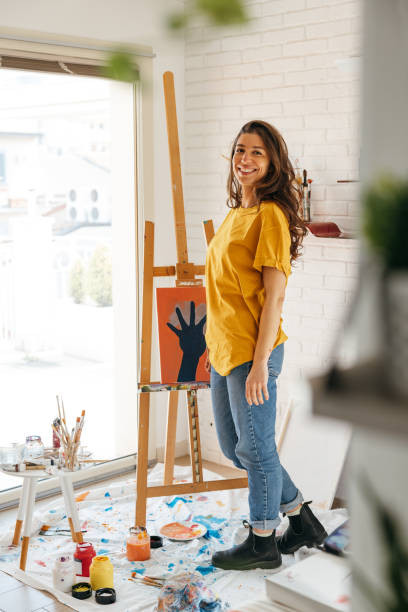 istock Artist portrait in her studio 1305976443