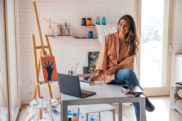 istock Artist portrait in her studio 1305976704