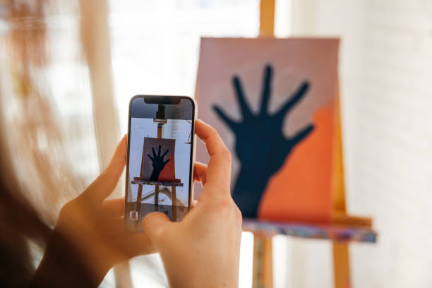 Artist taking a picture of her 