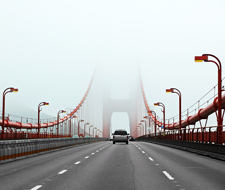 Traffic crossing a foggy Golden Gate Bridge in San Francisco