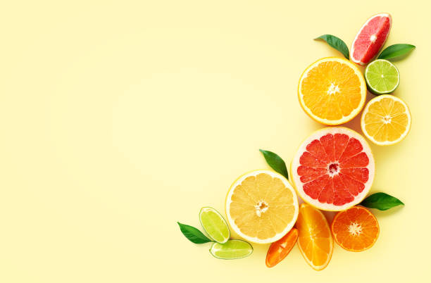 istock Creative composition of citrus fruits on yellow background 1305978903