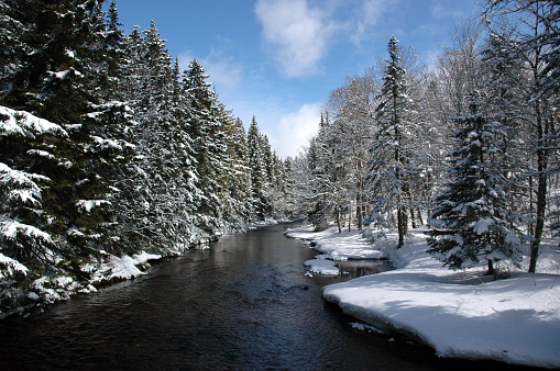 A river landscape covered in fresh snow.