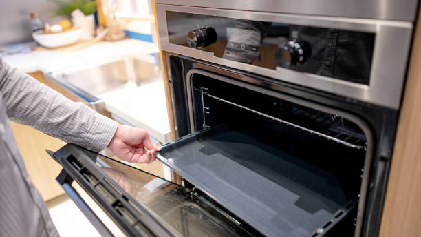 istock Male hand opening oven door 1305981639