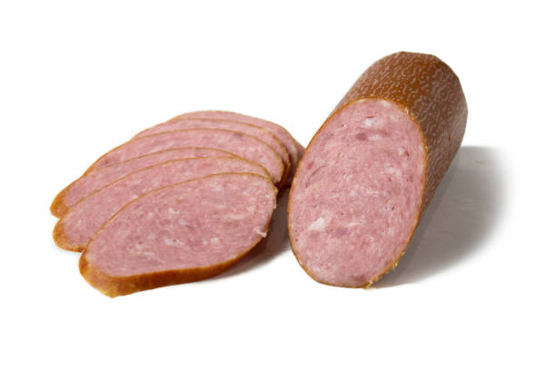 istock Appetizing sliced sausages, close up, isolated on white background 1305981660