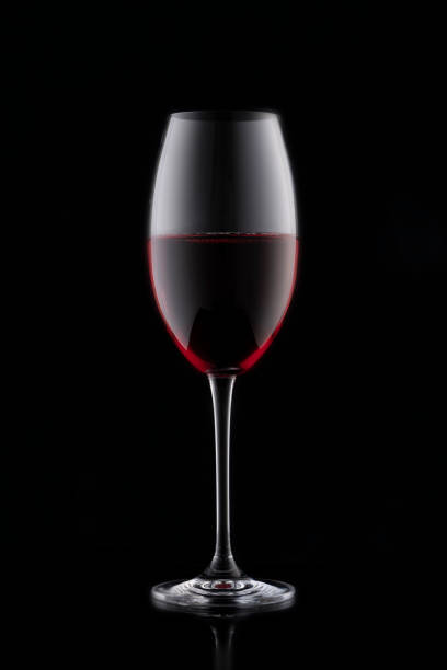 istock a glass of red wine on a black background 1305982008