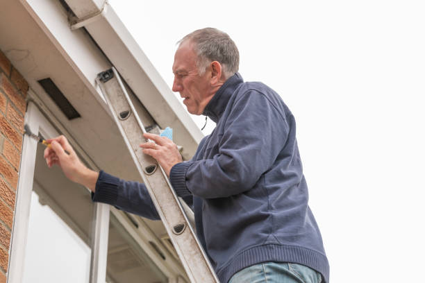 istock Senior man cleaning and putting sealant around leaking windows 1305982769