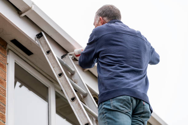 istock Senior man putting sealant around leaking windows 1305982870