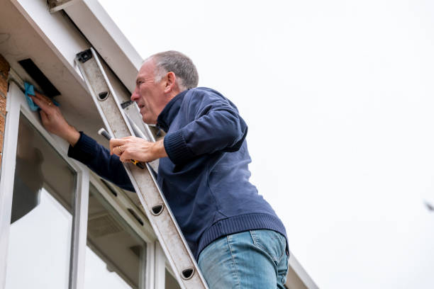 istock Senior man cleaning and putting sealant around leaking windows 1305982921