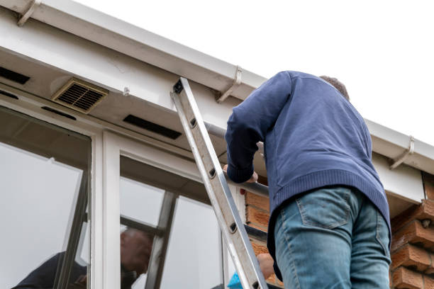istock Senior man cleaning and putting sealant around leaking windows 1305982978
