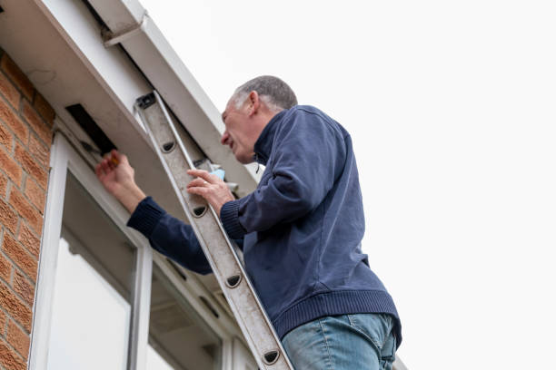 istock Senior man cleaning and putting sealant around leaking windows 1305983003