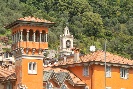 Private houses and villas in Sala Comacina on Lake Como in Lombardy, Italy. Villa La Torre dell'Isola is in the foreground.