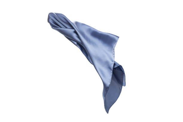 istock Flowing blue silk scarf isolated on white background. 1305984372