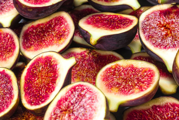 istock Tasty figs background. Top view. 1305984472