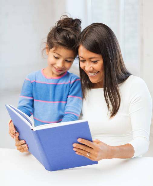istock mother and daughter with book 1305984650