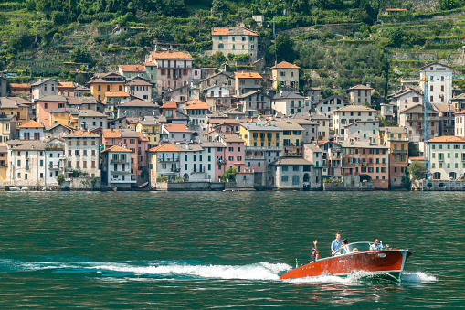 Tourists on a tourboat off Brienno on Lake Como in Lombardy, Italy