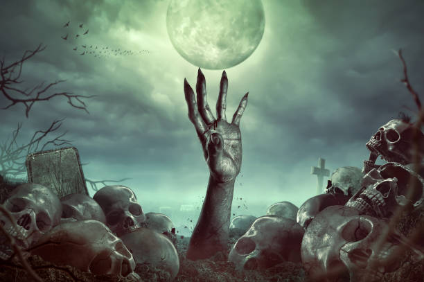 istock Zombie hand rising in dark Halloween night. 1305988475