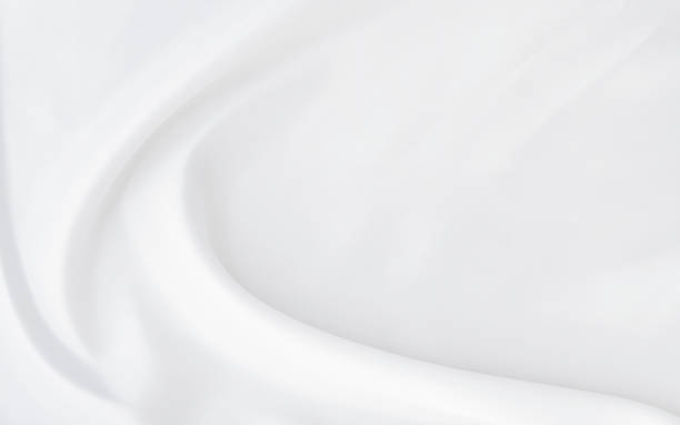 istock White gray satin texture that is white silver fabric silk background with beautiful soft blur pattern natural. 1305990842
