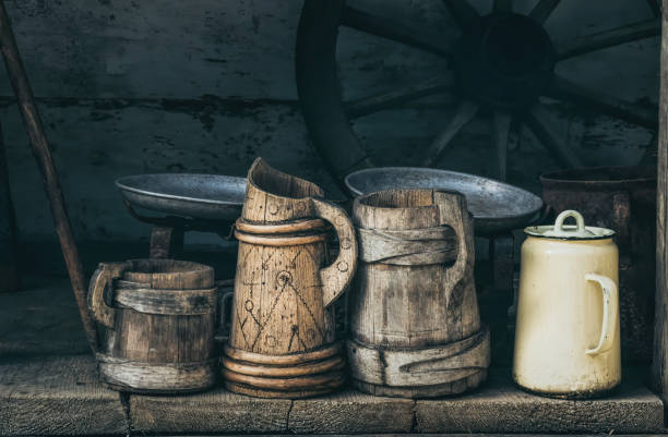 old wooden beer mugs and jugs. rustic antique tableware - milk old fashioned retro revival still life imagens e fotografias de stock