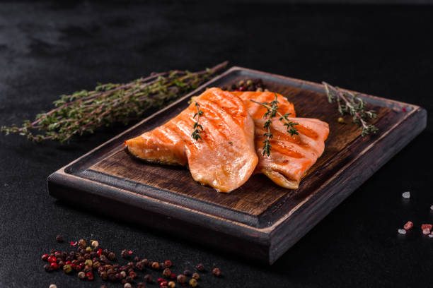 istock Tasty fresh red fish arctic char baked on a grill 1305994625