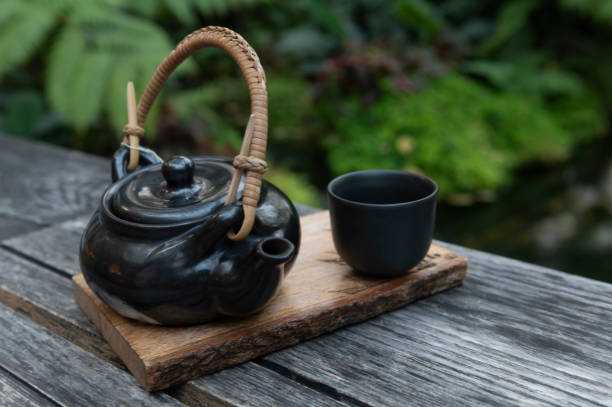 istock Black Japanese tea cup on wooden background, 1305994847