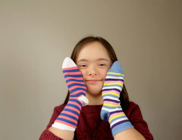 istock Cute smiling down syndrome girl 1305998732